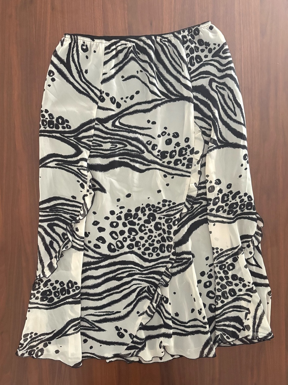 Chic TanJay midi skirt featuring a unique black and white mixed animal print